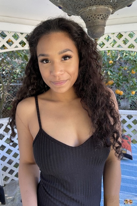 Amateur girl Kitt Lacey spreads her legs on a patio to show her vagina