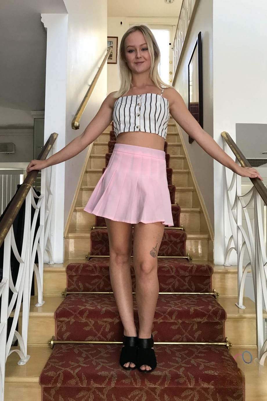 Natalia Queen teasing her bare shaved pink slit in sultry close-up - 1