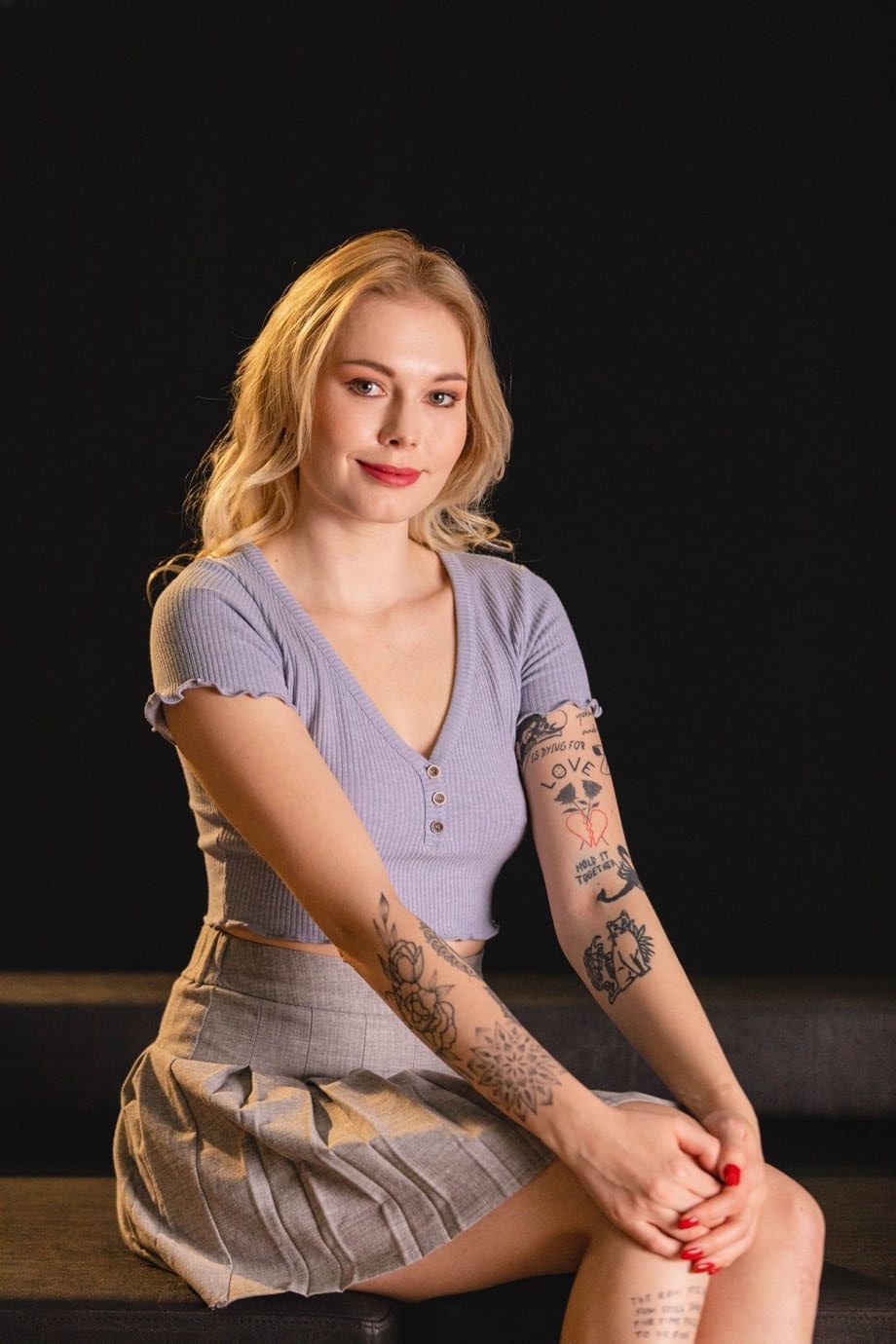 Tattooed teen Mimi Cica sports red lips while removing her clothing