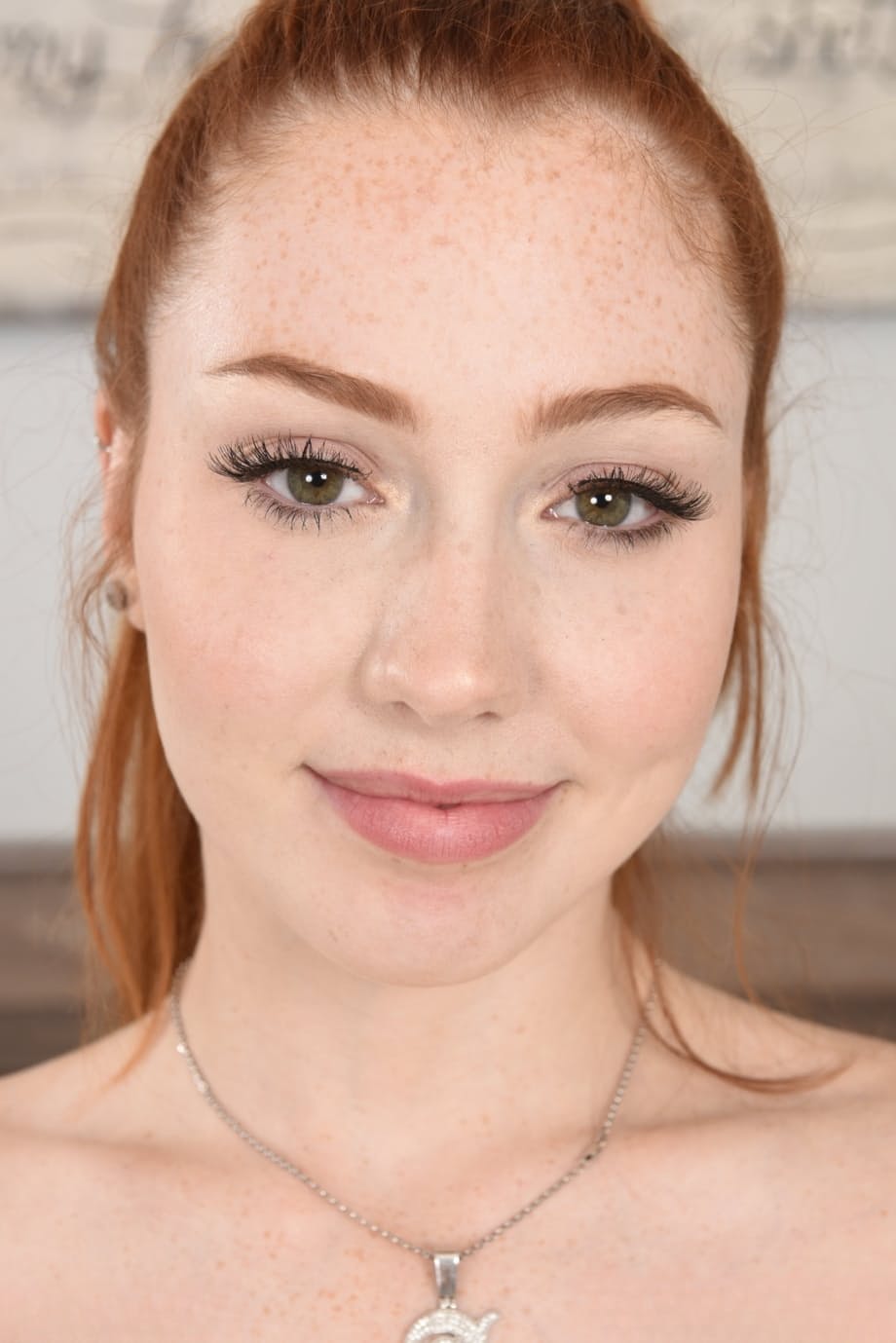 Redheaded babe Arietta Adams undresses & flaunts her feet, big ass & holes