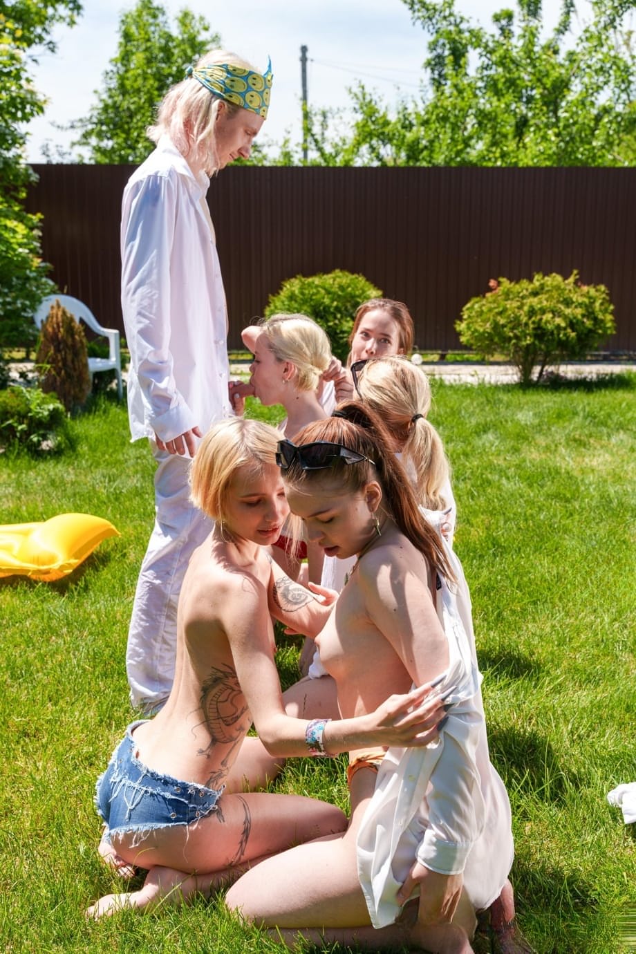 Slutty babes give each other a pussy licking in a wild outdoor orgy