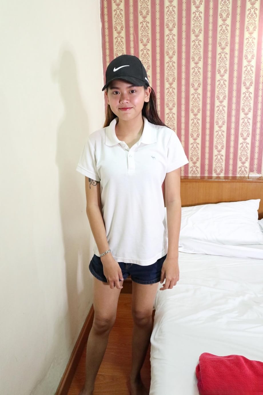 Pretty Asian girl Sprite unveils her wonderful tits and her hairy pussy