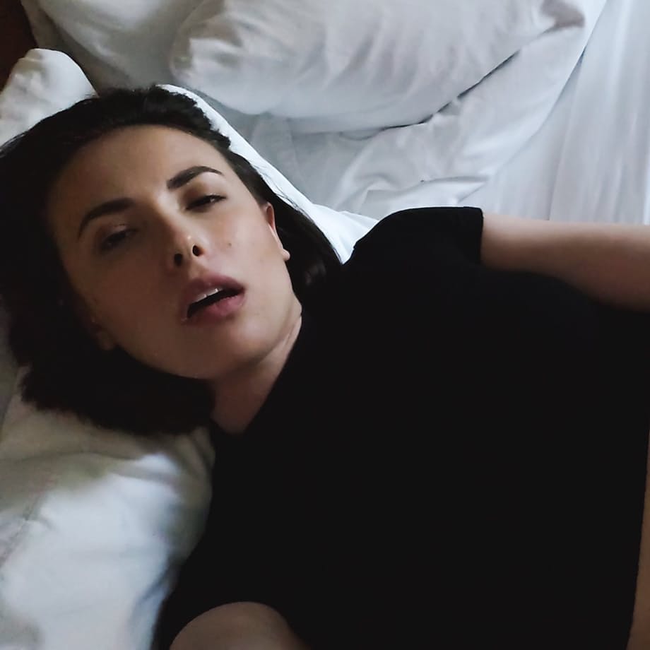 Sexy brunette babe fucks a muscular guy in an erotic bedroom scene