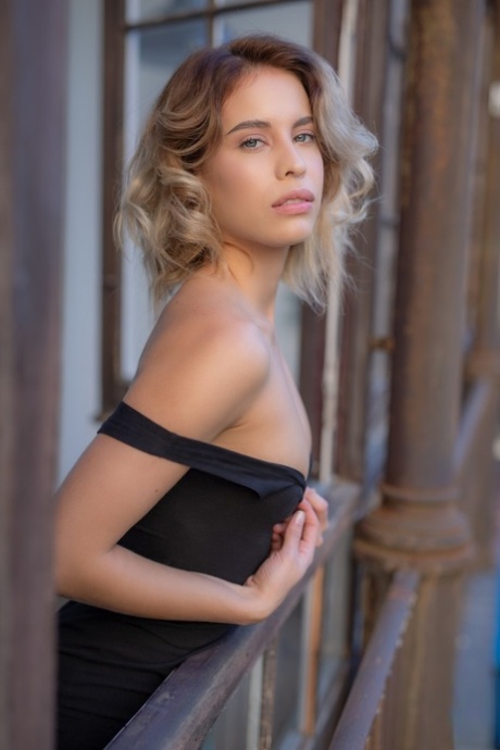 Tiny titted pretty babe Toni Maria shows her sexy tattoo and slim body