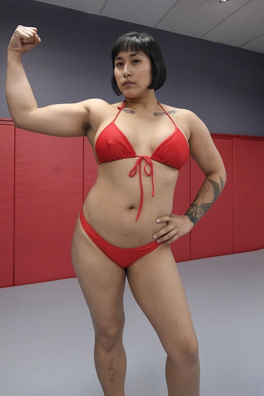 Asian femdom Mia Little has strapon anal sex with a man while wrestling him
