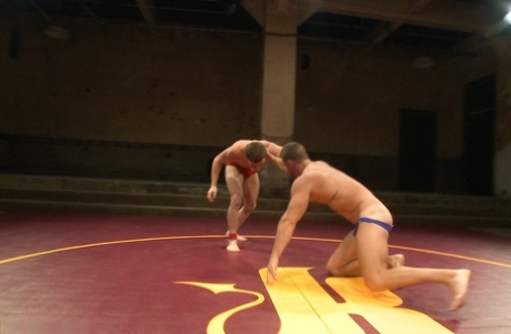 Doug Acre and rival wrestler shed briefs during their sweaty, naked arena bout - 8