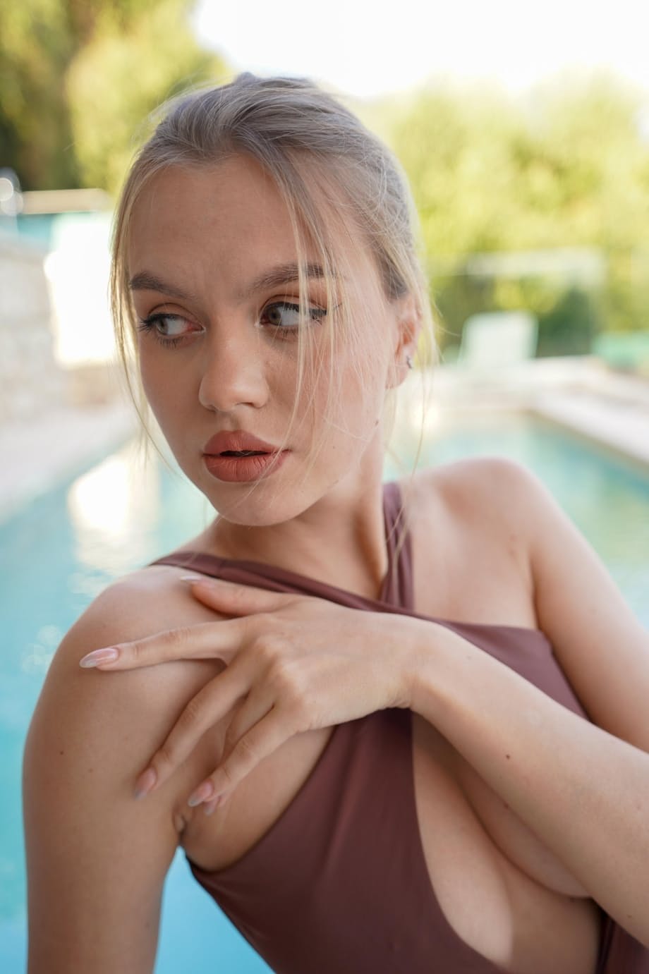 Busty blonde Lana Lane strips her swimsuit to reveal massive oiled tits - 5