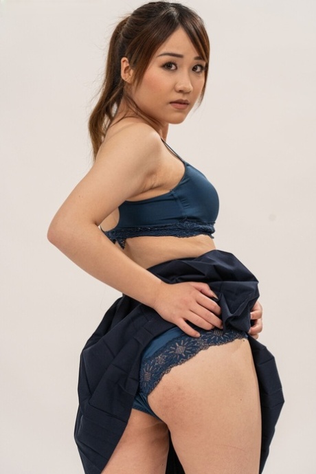 Asian teen Ciel Tokyo removes her schoolgirl outfit to pose nude