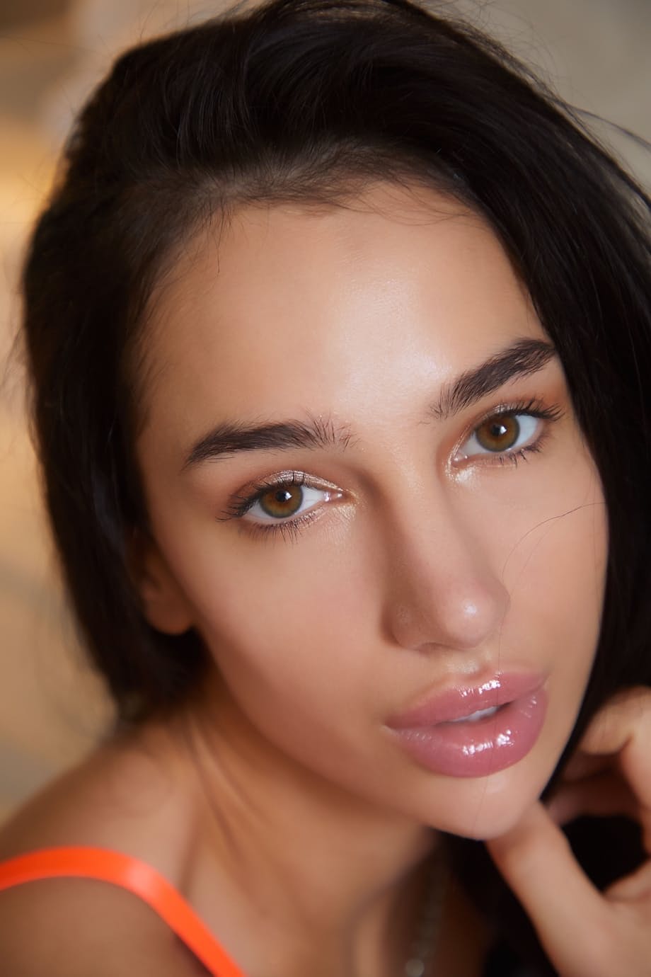 Pretty babe Kama Oxi removes her lingerie and shows her shaved pussy on a bed