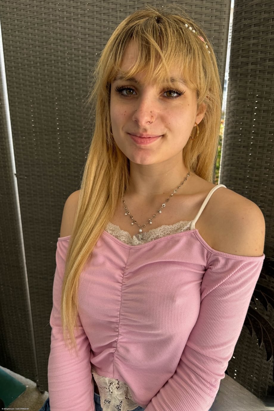 Skinny blonde Evie Christian highlights her tight asshole while mostly naked