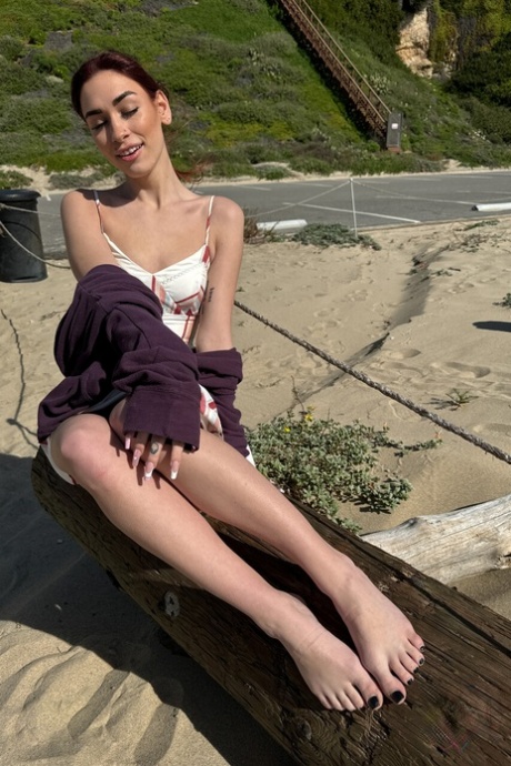 Delilah Day teases in sensual bed poses before stripping naked on the beach - 17