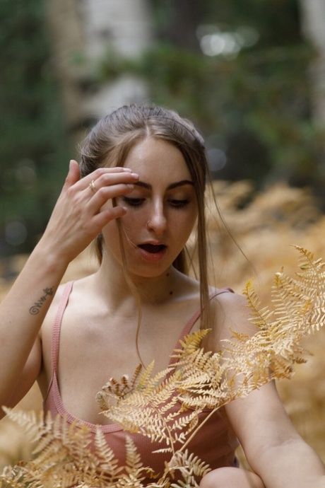 Kay Kay displays her big natural tits outdoors while teasing in the wilderness - 7