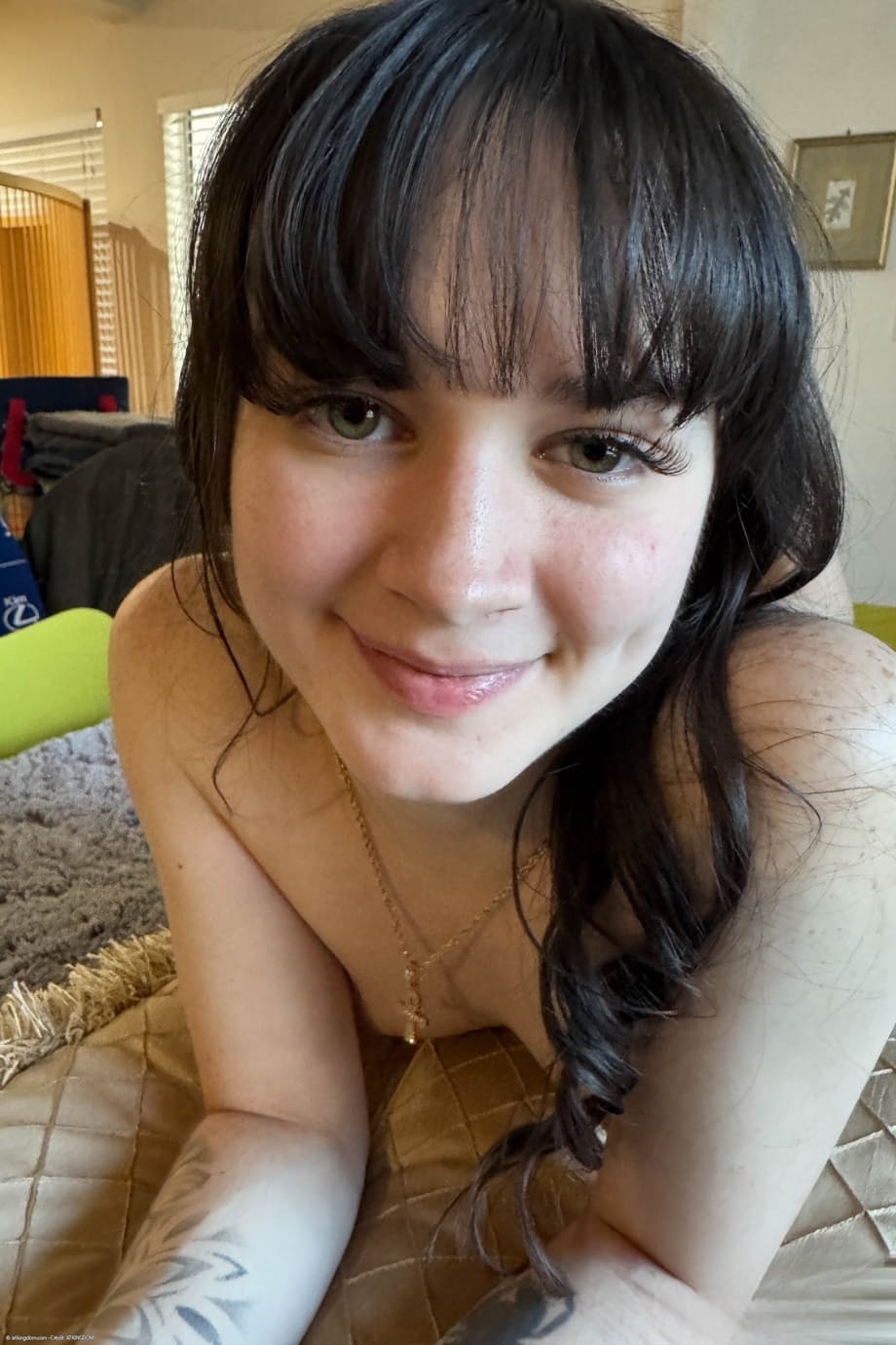 Dark-haired teen Remi Raw gets totally naked while at home by herself