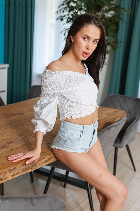 Slender temptress Alyssa Bounty strips bare atop elegant dining table - 2