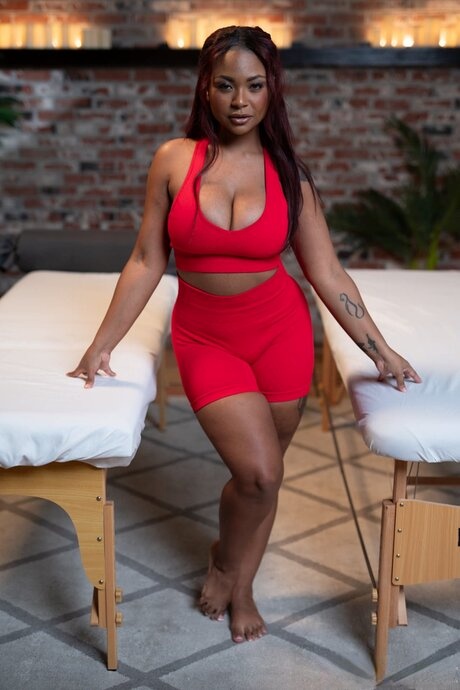 Two ebonies and a redheaded shemale reveal their big tits and fuck in a 3some
