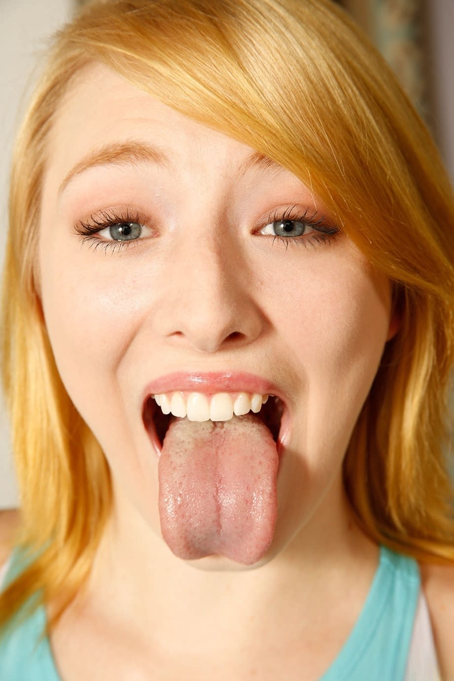 Blonde cutie Trillium strips, kneels down and worships a rock-hard dick