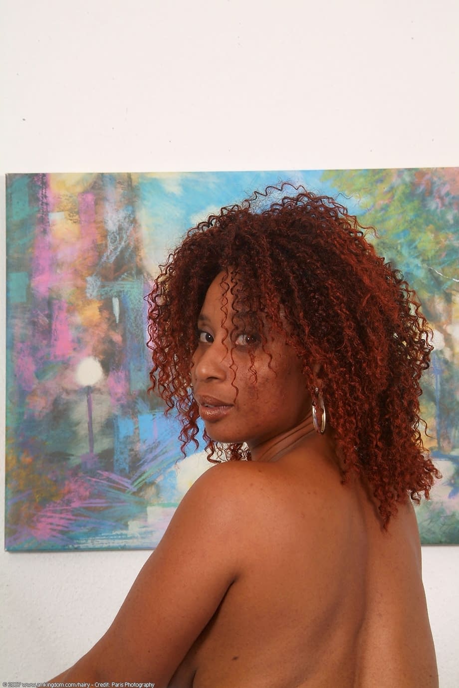 Macy seductively strips nude, showcasing her fiery ebony curves atop her bed - 20