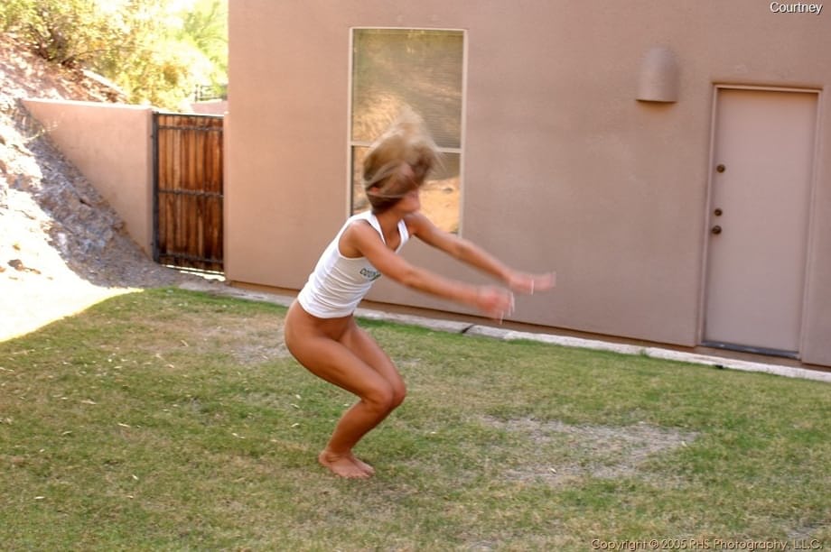 Courtney Simpson flashes her hairless pussy mid-air in an explicit backyard handstand - 16