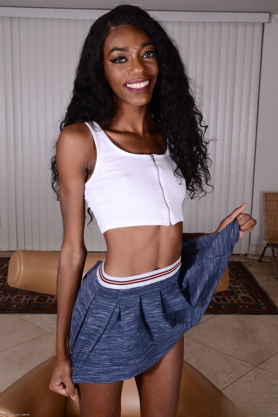 Alluring skinny ebony Chanel Skye reveals her brown muff and small tits