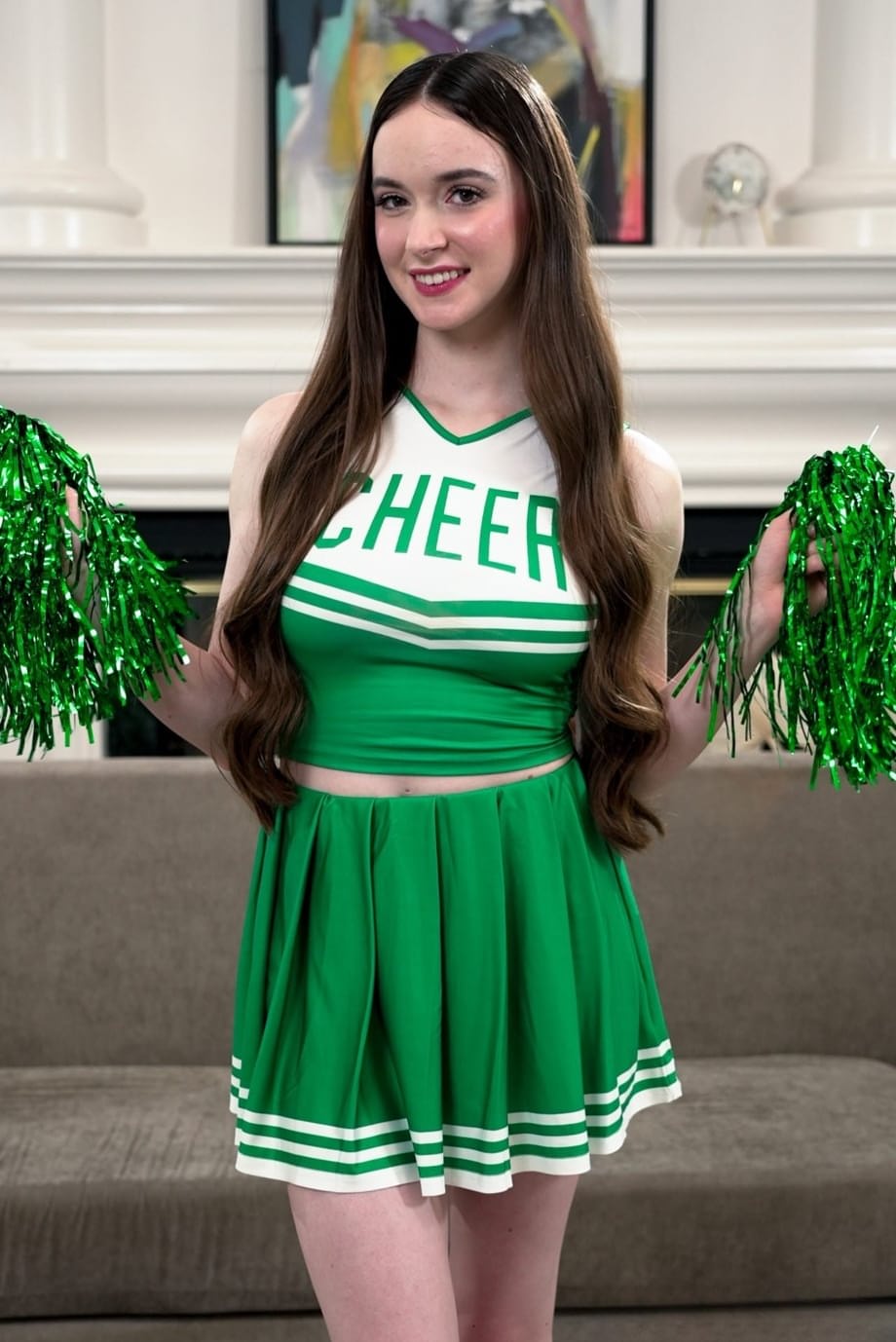 Cheerleaders Hazel Moore and Harley Love have lesbian sex on a sofa