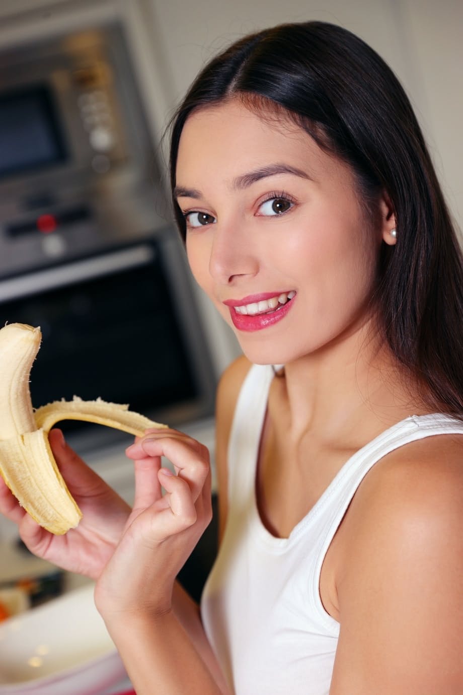 Shelena strips bare in the kitchen teasing long hair after licking her banana - 2