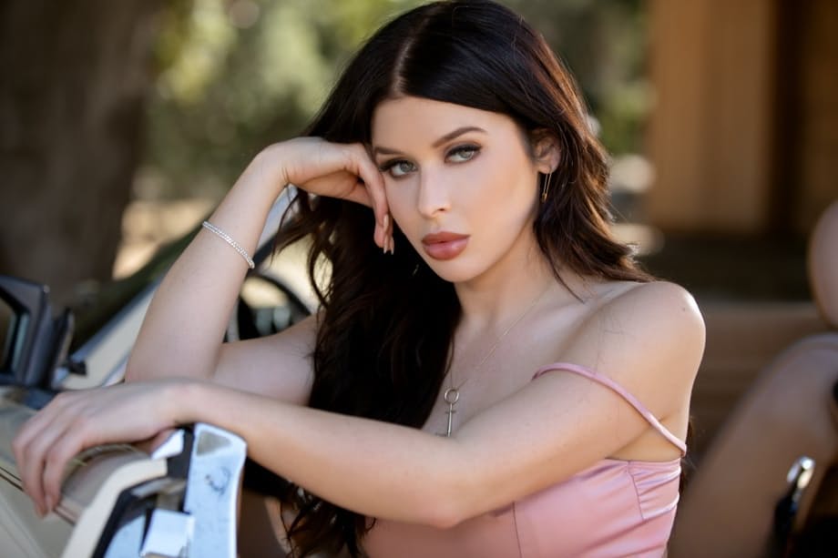 Sultry Renee Olstead strips bare against a car hood deep in woods - 6