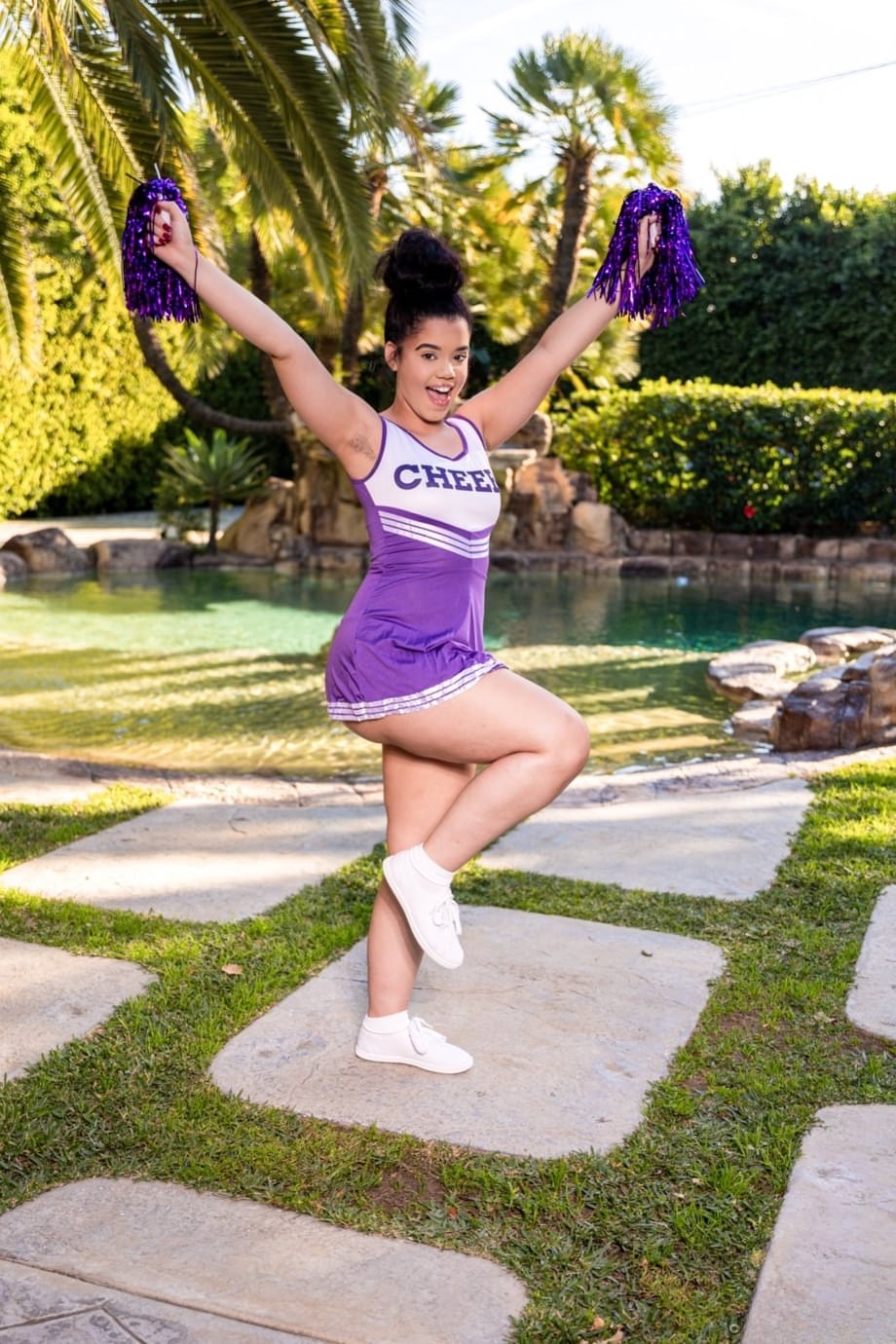 Archer Ali offers oral pleasure to a throbbing cock in sultry cheerleader attire outdoors - 2