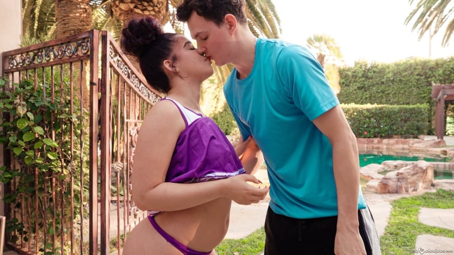 Archer Ali offers oral pleasure to a throbbing cock in sultry cheerleader attire outdoors - 14