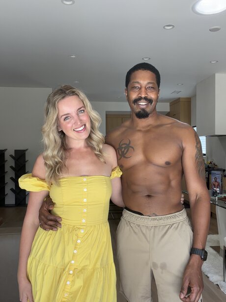 Sexy blonde CHARLIE FORDE strikes tempting solo poses on a bed in a yellow dress